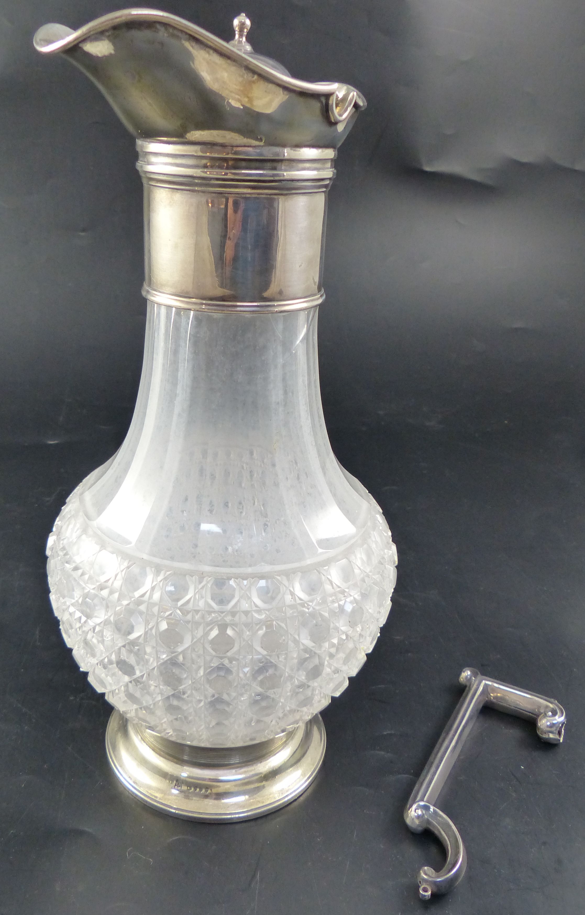 A Victorian silver mounted cut-glass claret jug, height 27.9cm (handle and lid detached/broken)